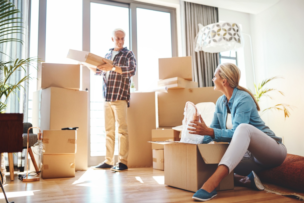 A couple packing up their home to move.