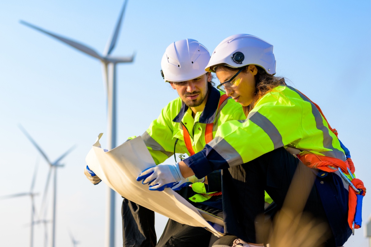 Technicians working at a wind farm.