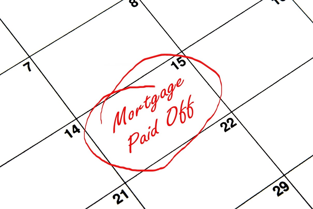 A calendar with “mortgage paid off” written on it.